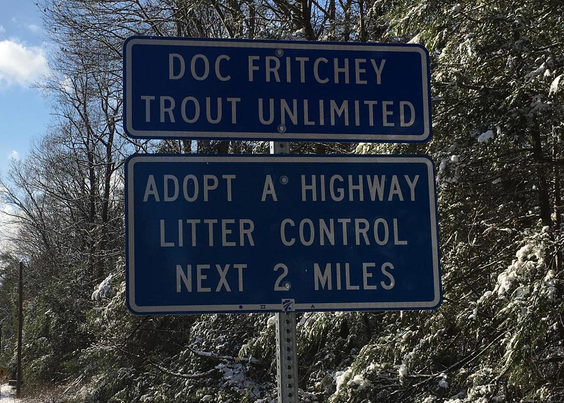 Doc Fritchey Trout Unlimited sign. Adopt A Highway Litter Control Next 2 Miles.